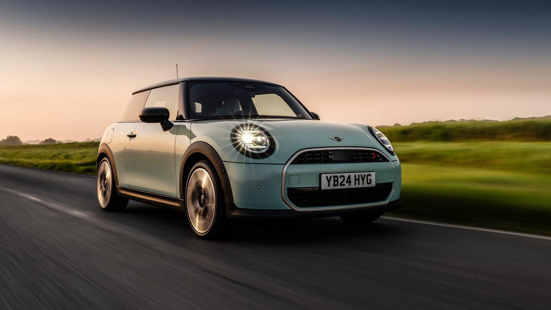 MINI Cooper driving down the road